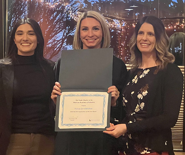 Voices for Children receiving an award